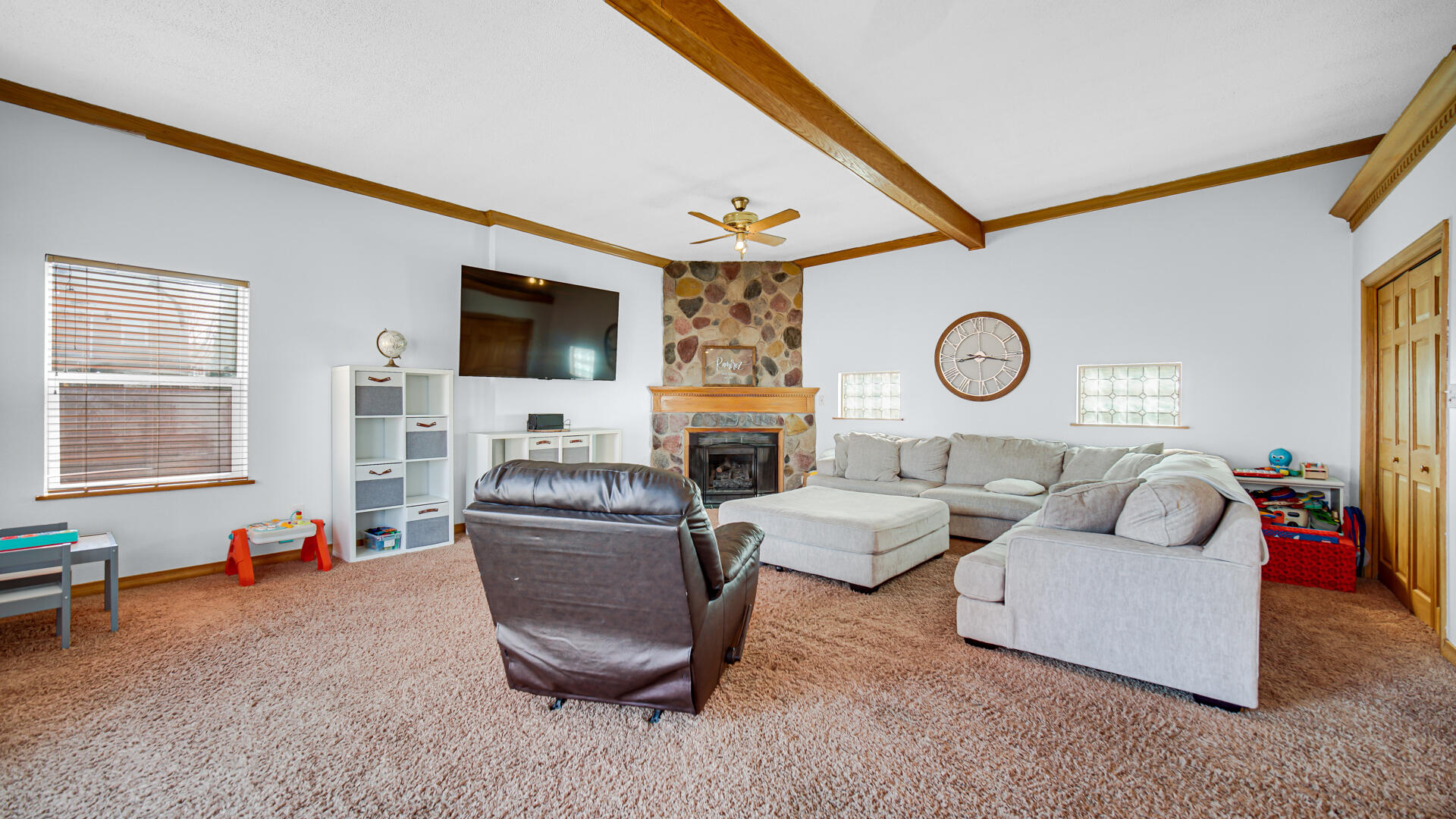 222 Beacon Place Munster, IN 46321 - Photo 3 of 30 a living room with fireplace furniture and a flat screen tv