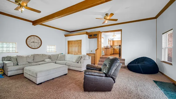 a living room with furniture and a window
