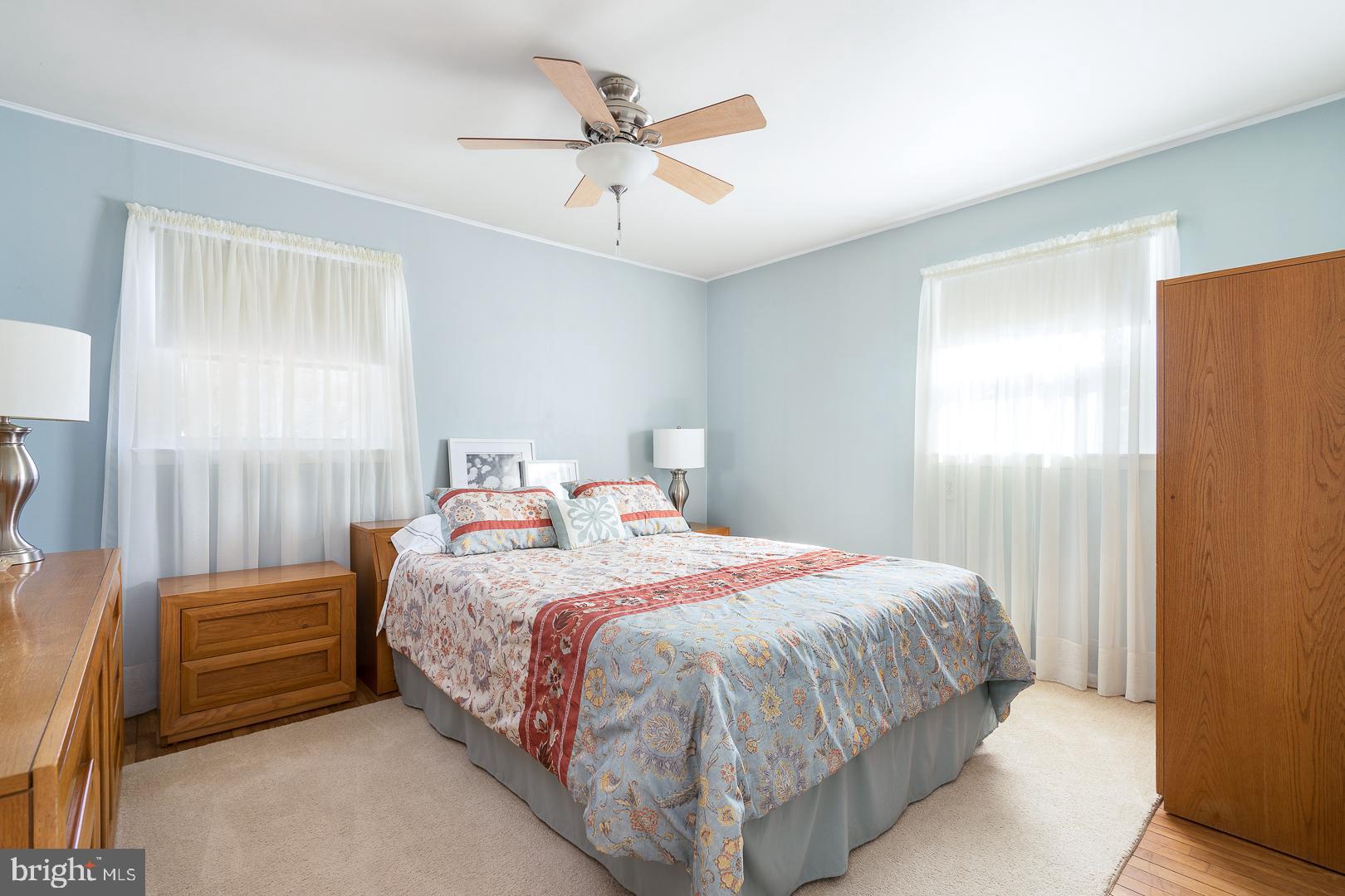 26 Endicott Road Hamilton, NJ 08690 - Photo 14 of 28 a bedroom with a bed and a ceiling fan