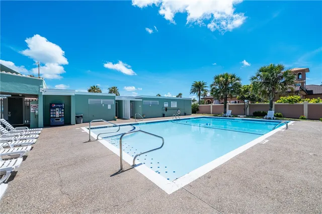 a view of a swimming pool with a patio