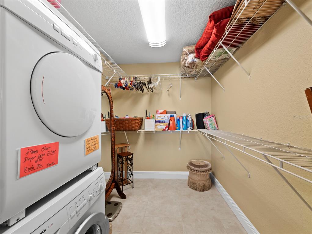 4430 Exeter Drive, Unit M108 Longboat Key, FL 34228 - Photo 27 of 65 a view of storage and utility room with racks on the wall