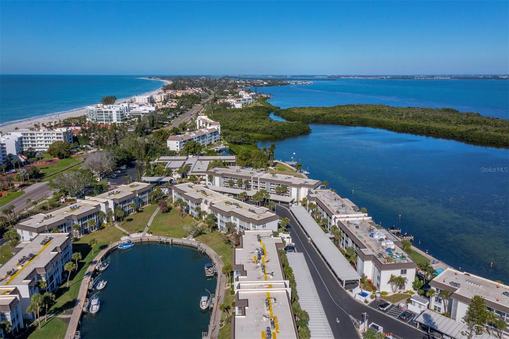 4430 Exeter Drive, Unit M108 Longboat Key, FL 34228 - Photo 57 of 65 an aerial view of a house with a ocean view