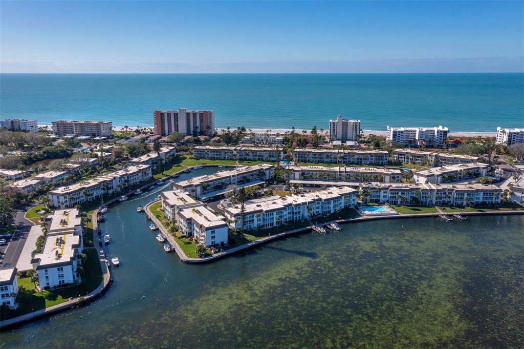 4430 Exeter Drive, Unit M108 Longboat Key, FL 34228 - Photo 62 of 65 a view of a city with lawn chairs
