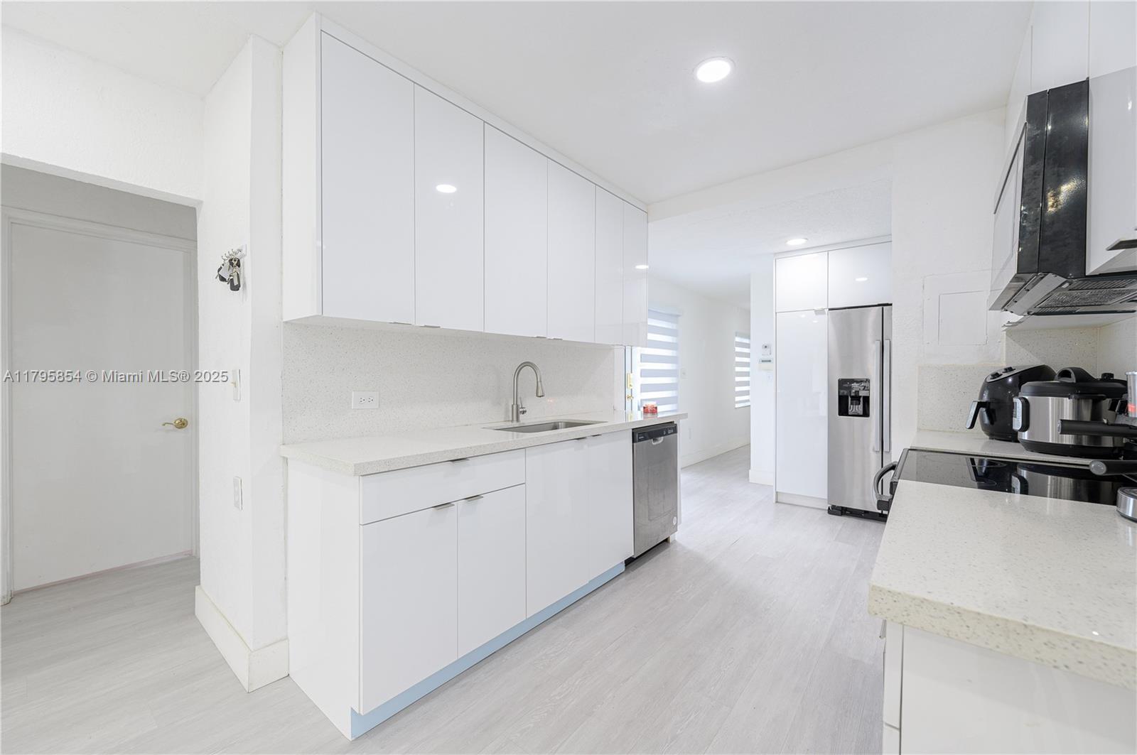 5200 Southwest 4th Street Miami, FL 33134 - Photo 15 of 35 a kitchen with a sink stove and refrigerator