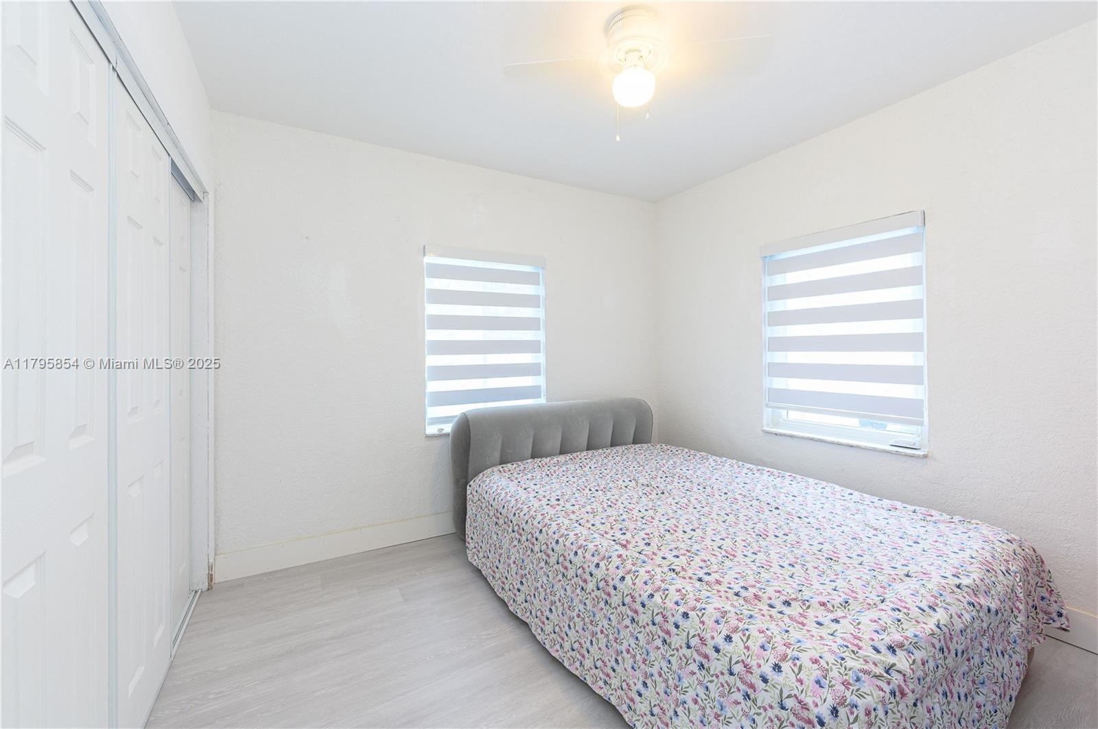5200 Southwest 4th Street Miami, FL 33134 - Photo 22 of 35 a bedroom with a bed and a window