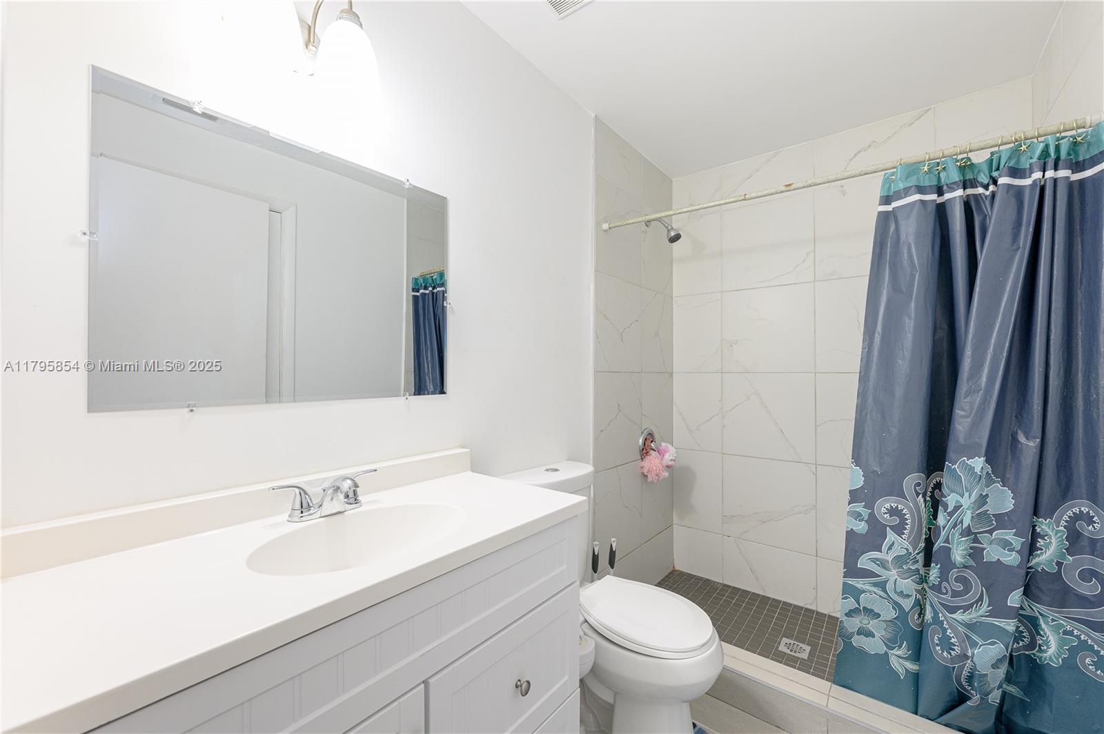 5200 Southwest 4th Street Miami, FL 33134 - Photo 24 of 35 a bathroom with a sink toilet and shower