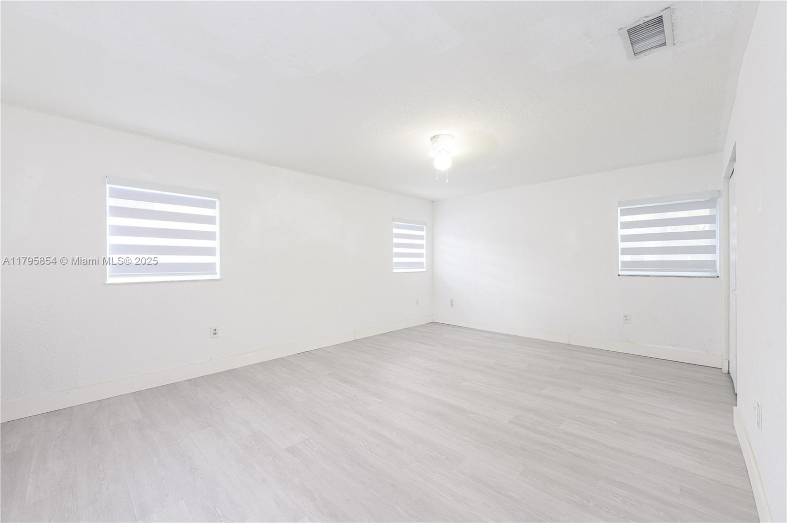 5200 Southwest 4th Street Miami, FL 33134 - Photo 25 of 35 an empty room with windows