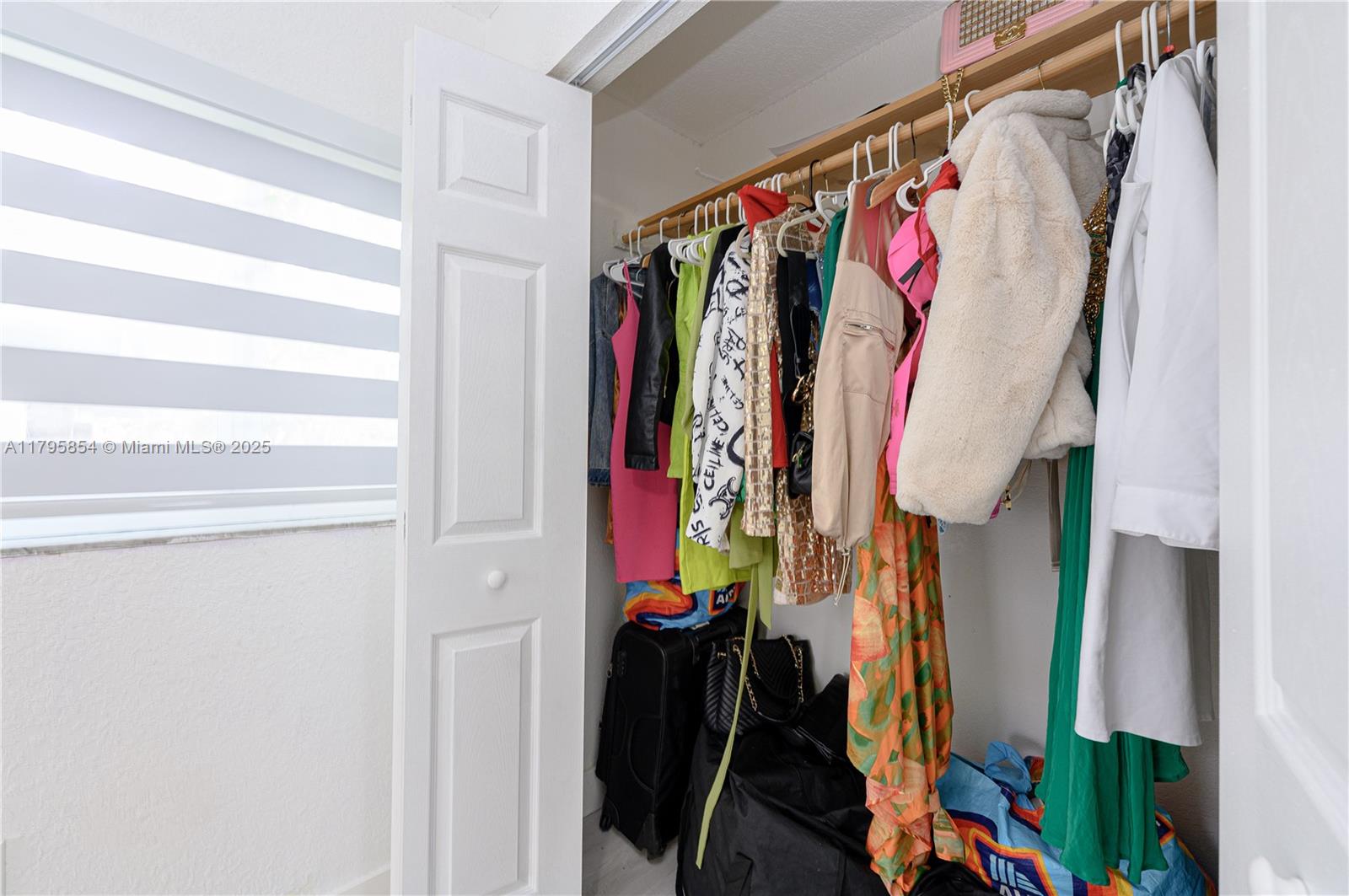 5200 Southwest 4th Street Miami, FL 33134 - Photo 27 of 35 a view of walk in closet with clothes