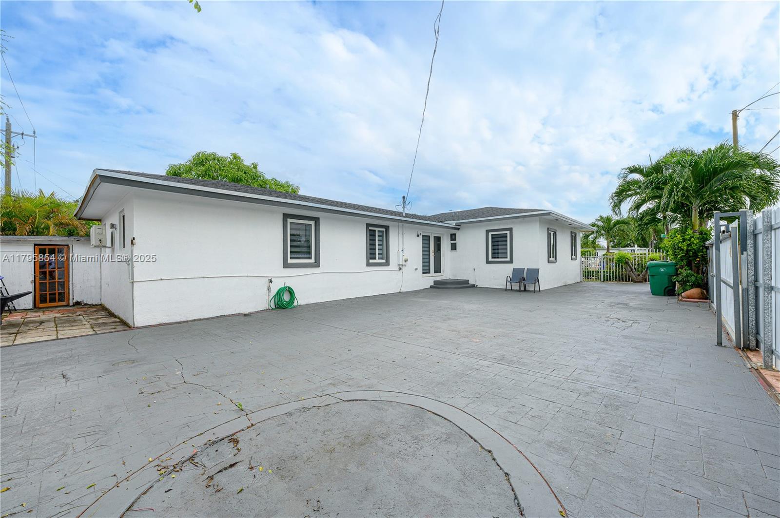 5200 Southwest 4th Street Miami, FL 33134 - Photo 32 of 35 a view of a house with a backyard and garage