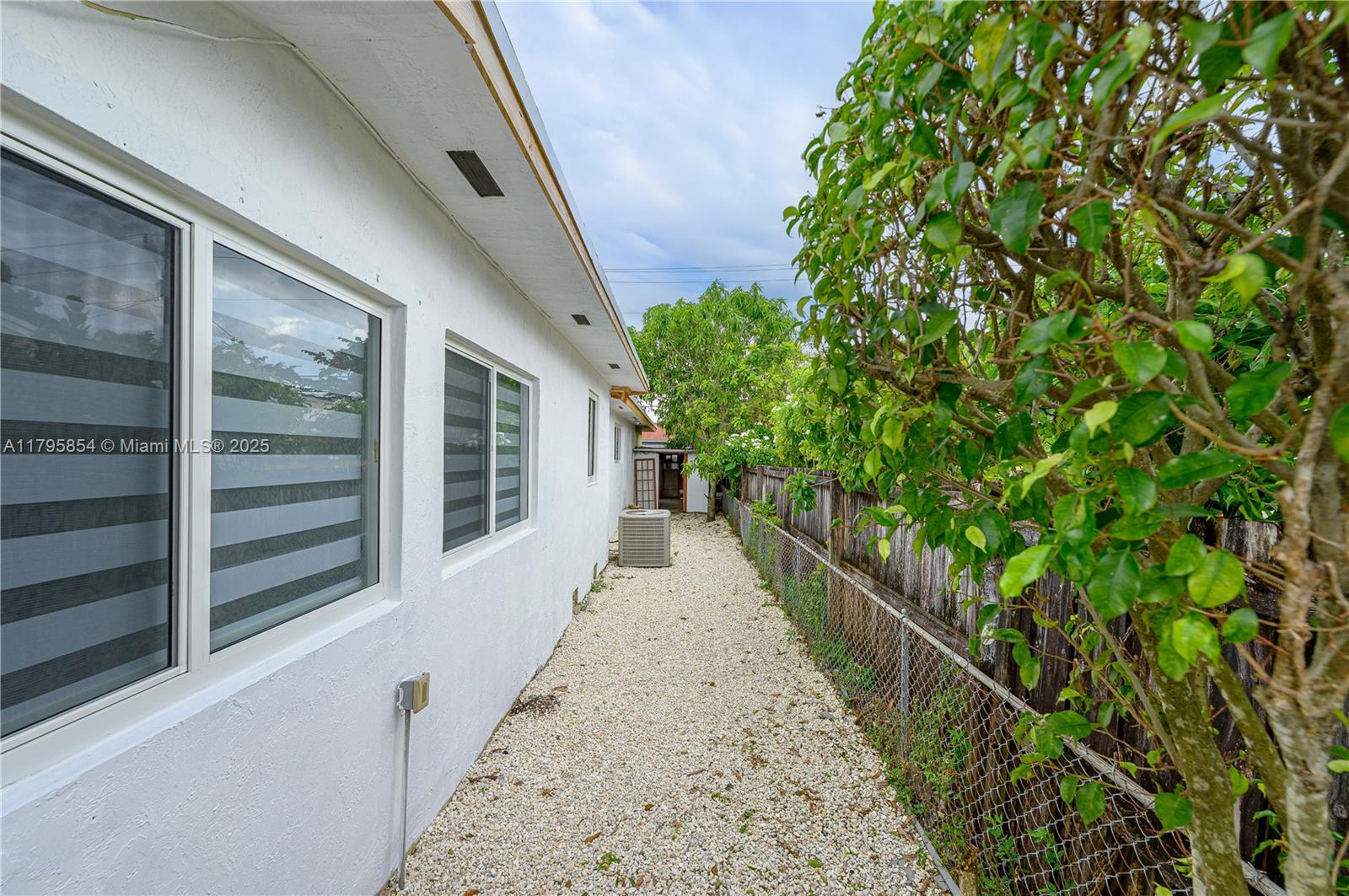 5200 Southwest 4th Street Miami, FL 33134 - Photo 35 of 35 a view of a pathway of a house with potted plants