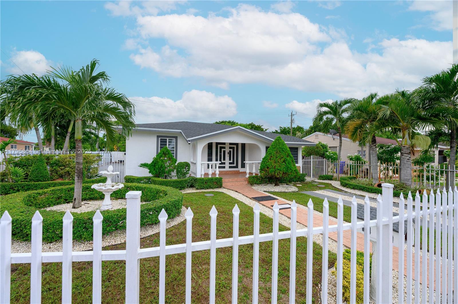 5200 Southwest 4th Street Miami, FL 33134 - Photo 4 of 35 a front view of house with yard and green space