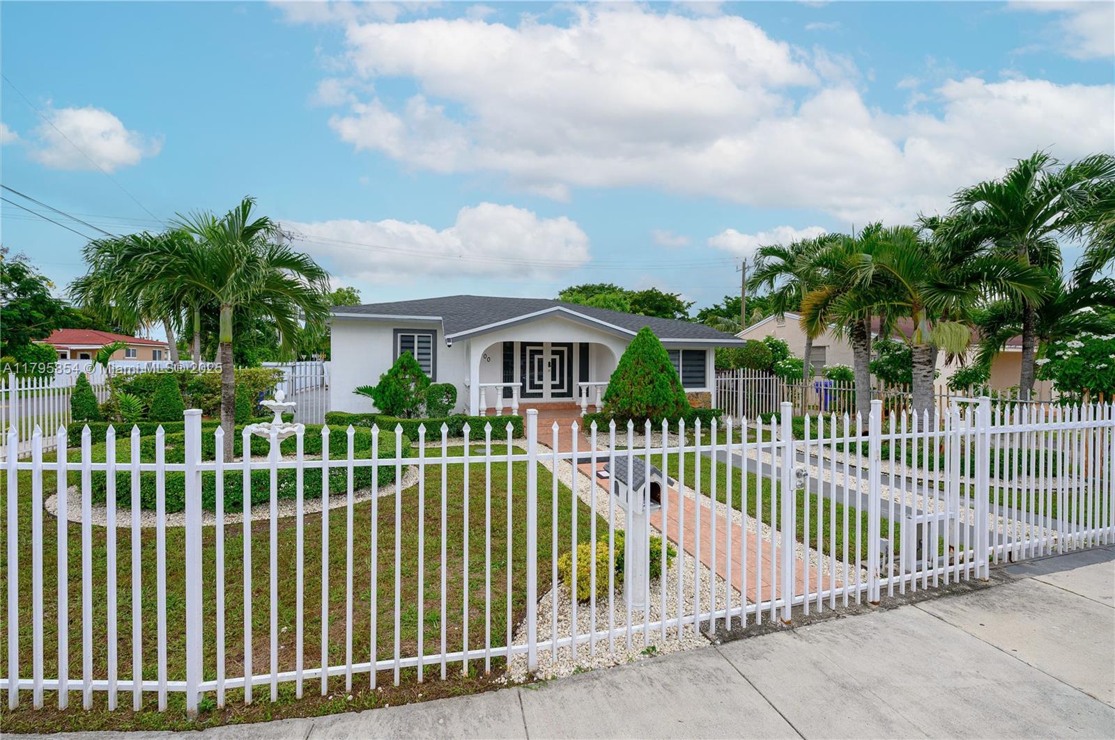 5200 Southwest 4th Street Miami, FL 33134 - Photo 6 of 35 a view of a house with a small yard and plants