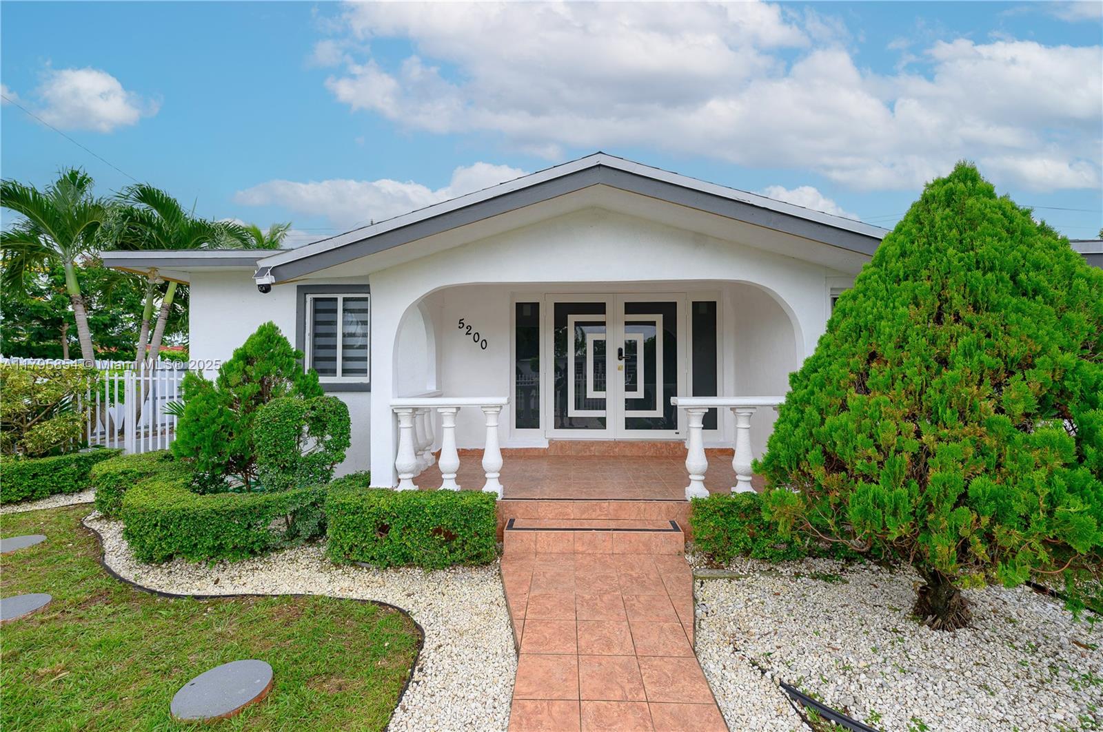 5200 Southwest 4th Street Miami, FL 33134 - Photo 7 of 35 a front view of a house with a yard
