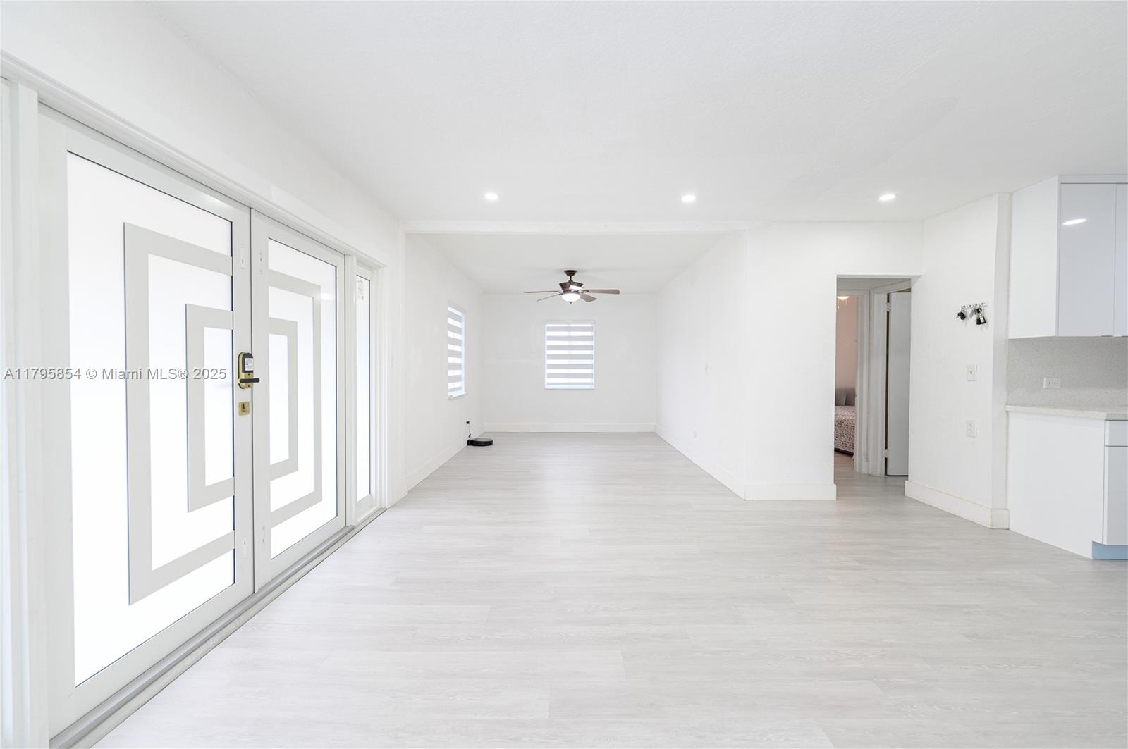 5200 Southwest 4th Street Miami, FL 33134 - Photo 10 of 35 a view of empty room with wooden floor and entryway