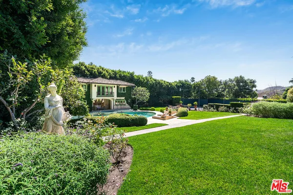 a front view of building with yard