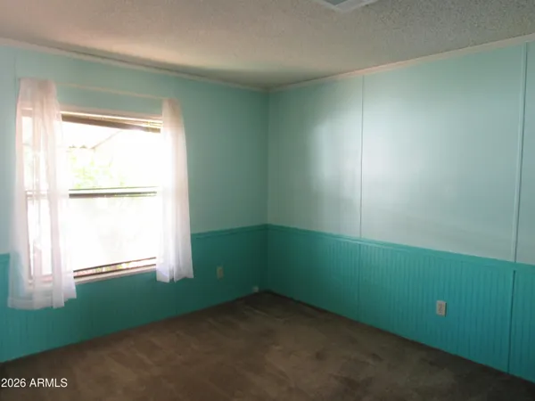 a room with a window and a fan