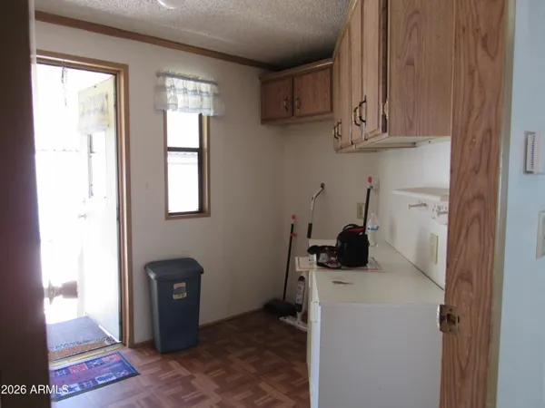 a view of a storage and utility room with a window