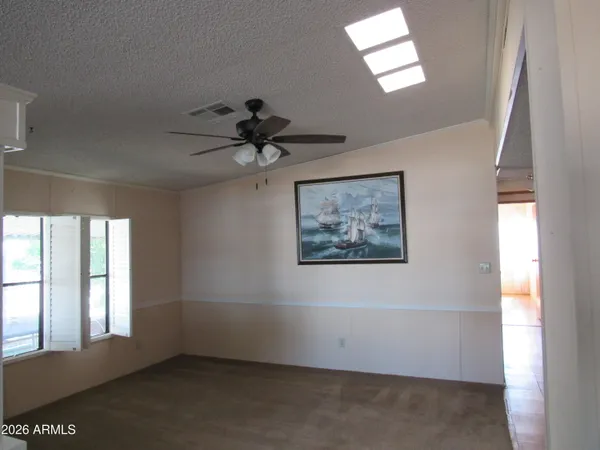 a view of an empty room and a window