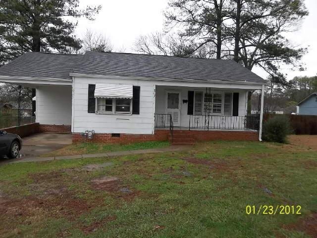 119 Hawthorn Street Rome, GA 30161 - Photo 1 of 1 a front view of a house with garden