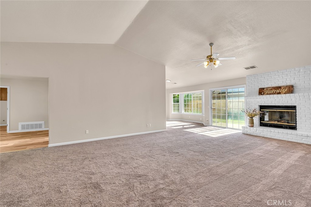 3546 Joerg Avenue Merced, CA 95340 - Photo 13 of 51 an empty room with windows and fireplace