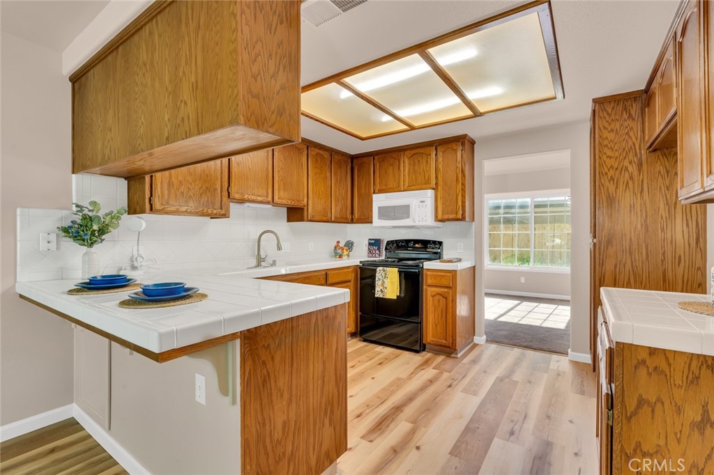 3546 Joerg Avenue Merced, CA 95340 - Photo 22 of 51 a kitchen that has a sink and a stove in it