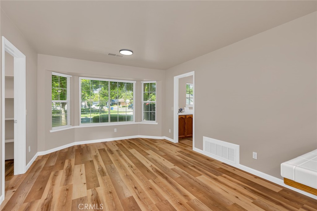 3546 Joerg Avenue Merced, CA 95340 - Photo 25 of 51 a view of empty room with wooden floor and fan