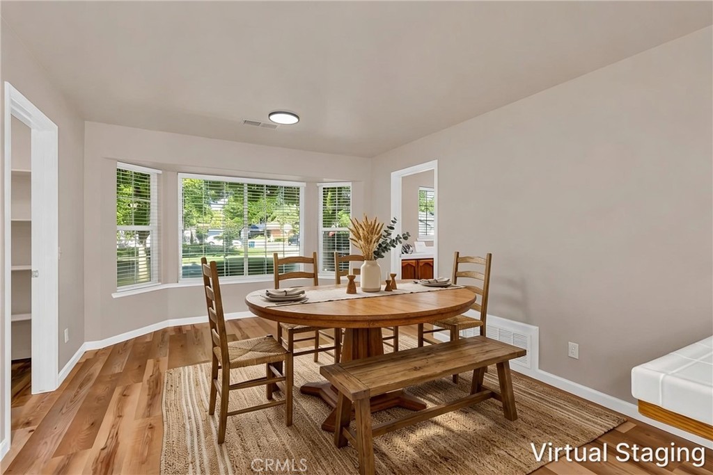 3546 Joerg Avenue Merced, CA 95340 - Photo 26 of 51 a view of a dining room with furniture and wooden floor