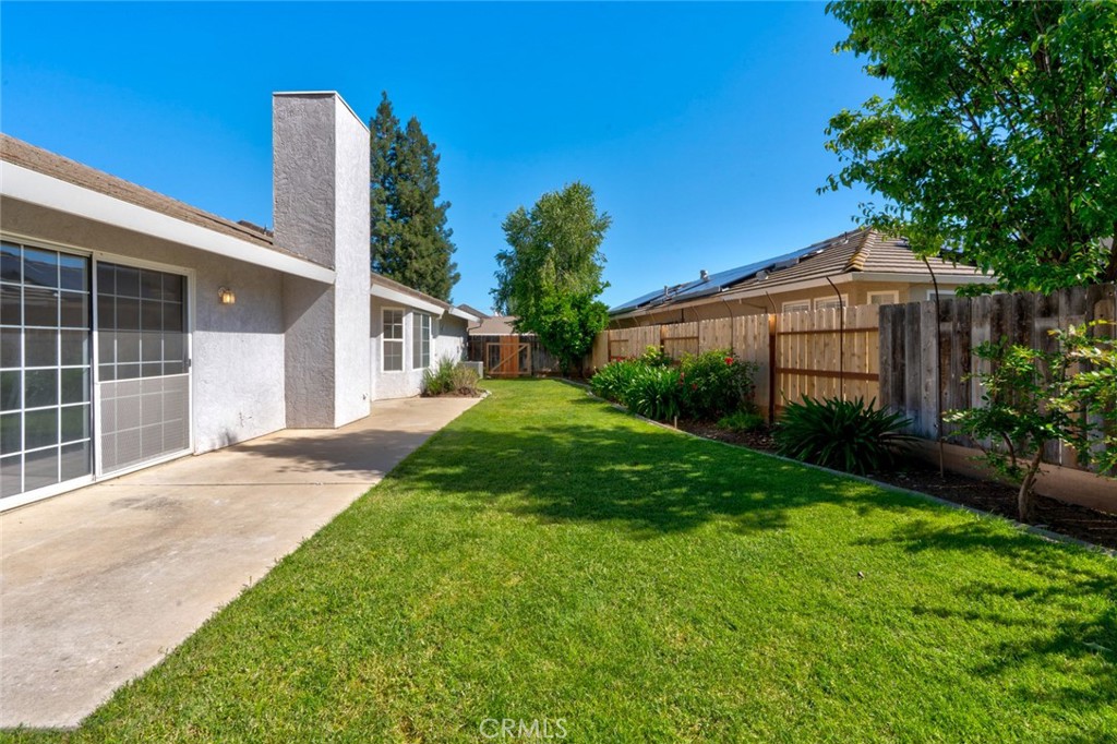 3546 Joerg Avenue Merced, CA 95340 - Photo 43 of 51 a view of a house with a yard and potted plants
