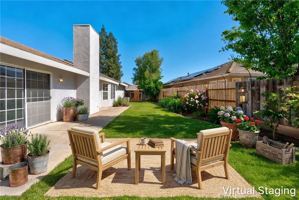 3546 Joerg Avenue Merced, CA 95340 - Photo 44 of 51 a view of a chair and table in backyard of the house