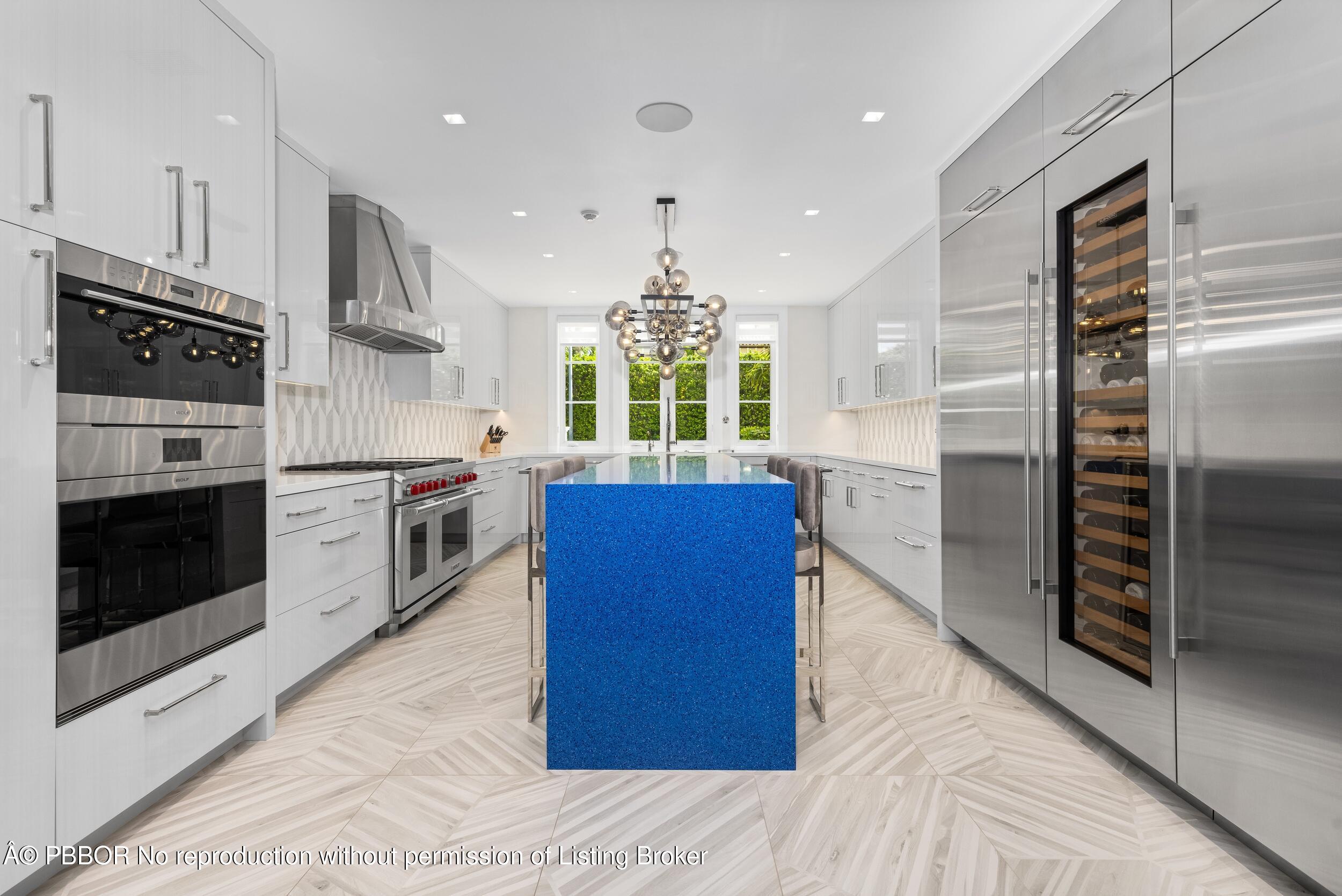 201 Banyan Road Palm Beach, FL 33480 - Photo 14 of 42 a kitchen with stainless steel appliances granite countertop a refrigerator a stove and a wooden floors