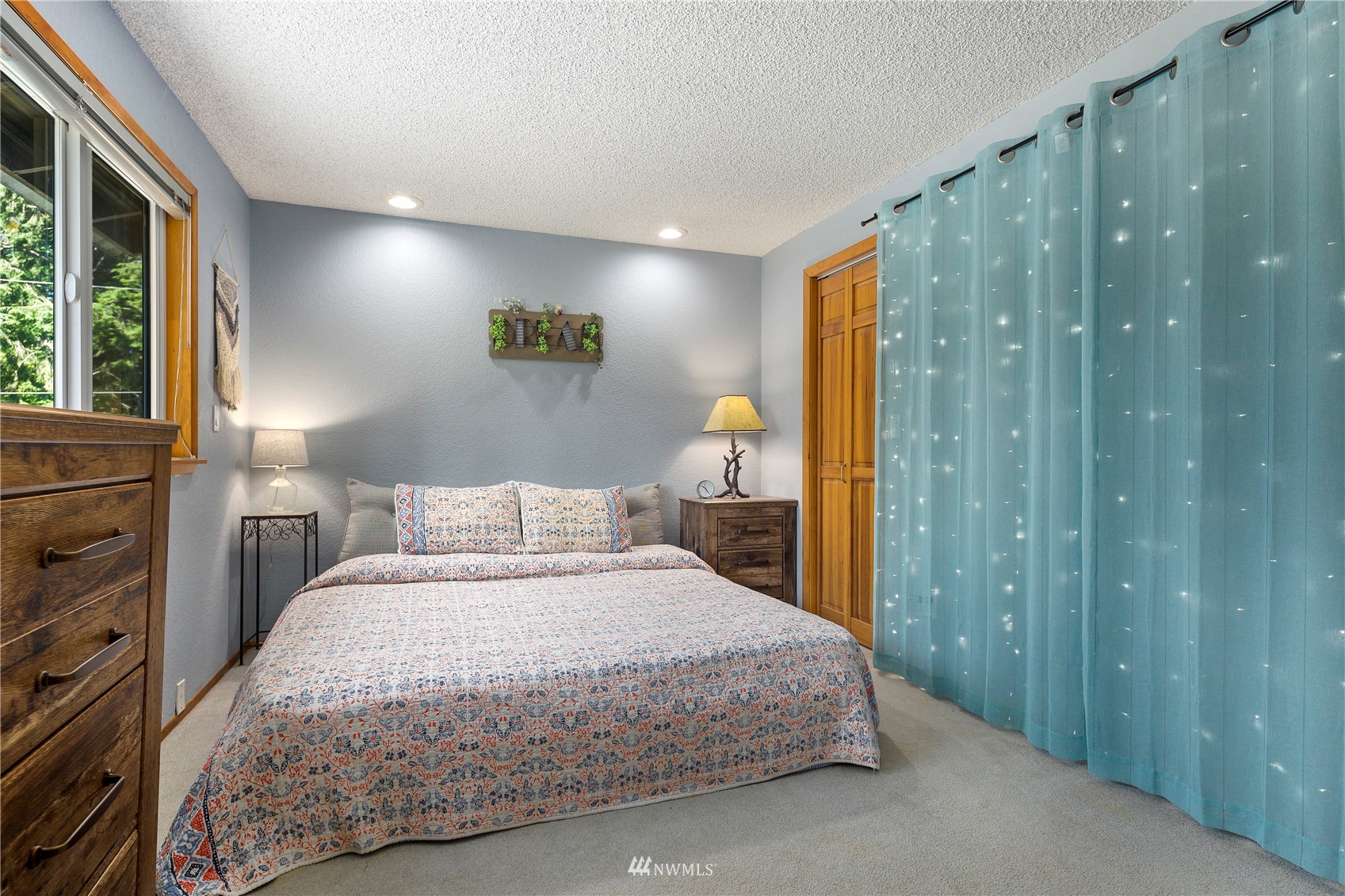 11715 Ingraham Road Snohomish, WA 98290 - Photo 17 of 38 a bedroom with a bed and a window