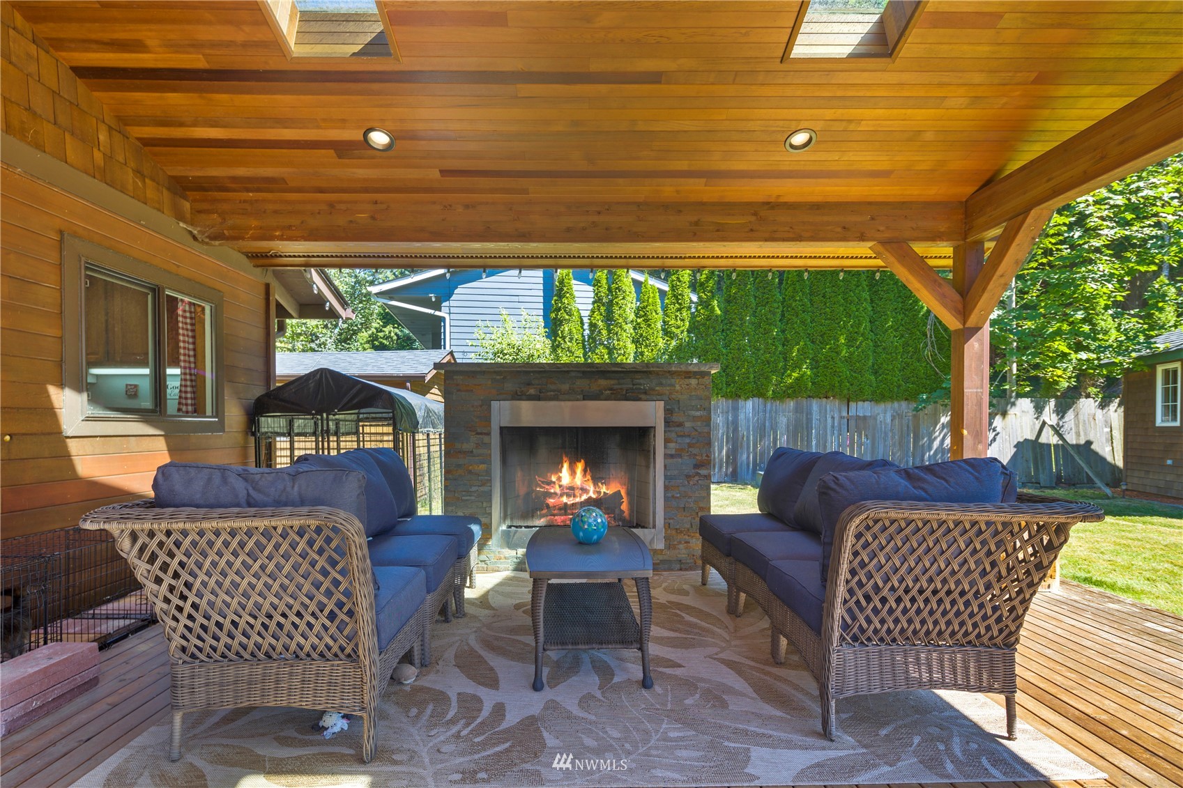 11715 Ingraham Road Snohomish, WA 98290 - Photo 26 of 38 a outdoor living space with furniture and a fireplace