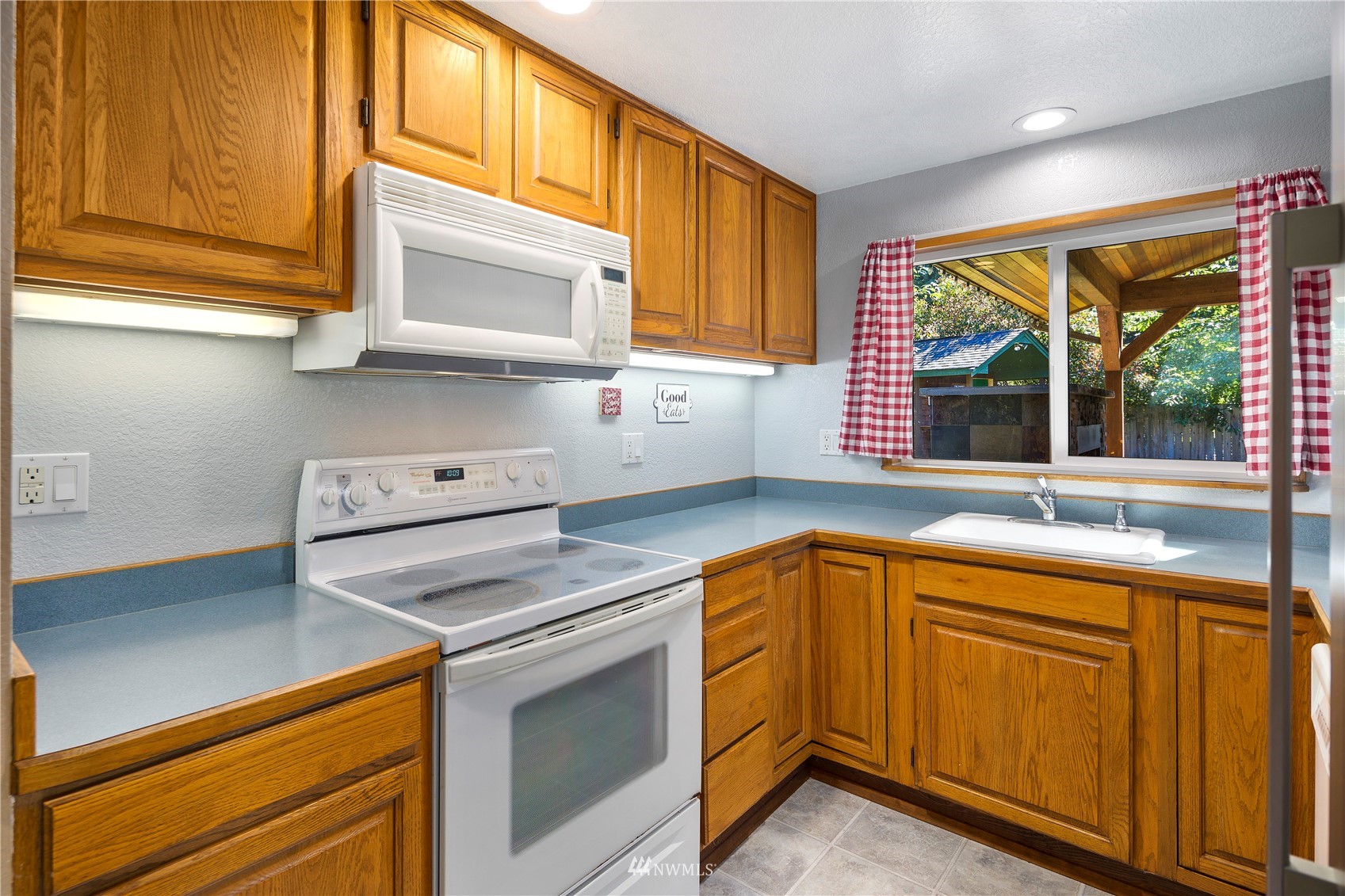 11715 Ingraham Road Snohomish, WA 98290 - Photo 10 of 38 a kitchen with a sink cabinets and window