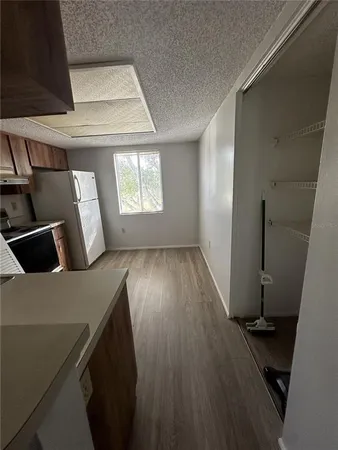 a view of kitchen and wooden floor