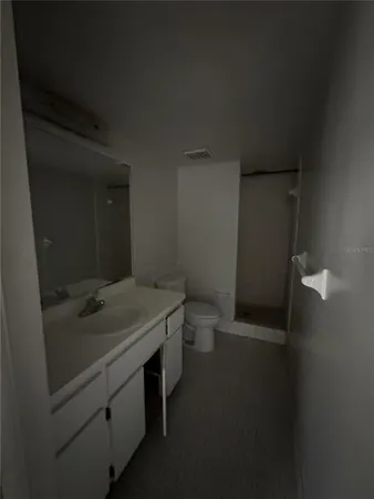 a bathroom with a sink and toilet