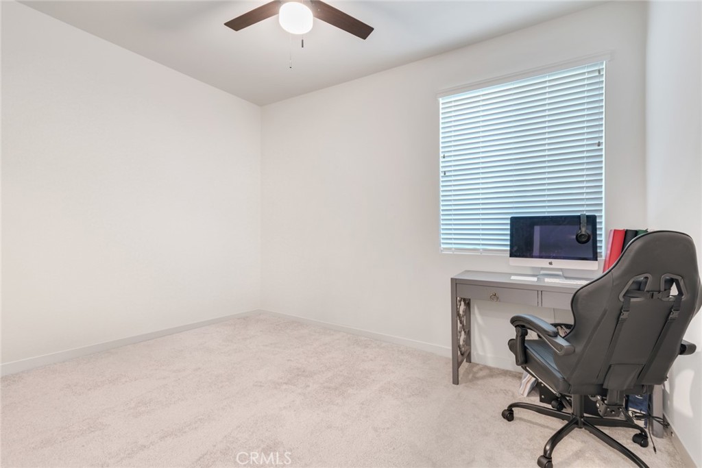 4247 Bravado Court Riverside, CA 92505 - Photo 13 of 33 a view of a workspace with furniture and a window