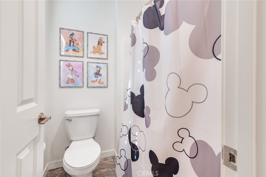 4247 Bravado Court Riverside, CA 92505 - Photo 18 of 33 a white toilet sitting next to a bathroom sink