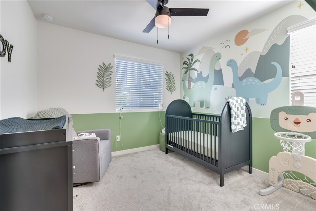 4247 Bravado Court Riverside, CA 92505 - Photo 21 of 33 a bedroom with a small bed and a window