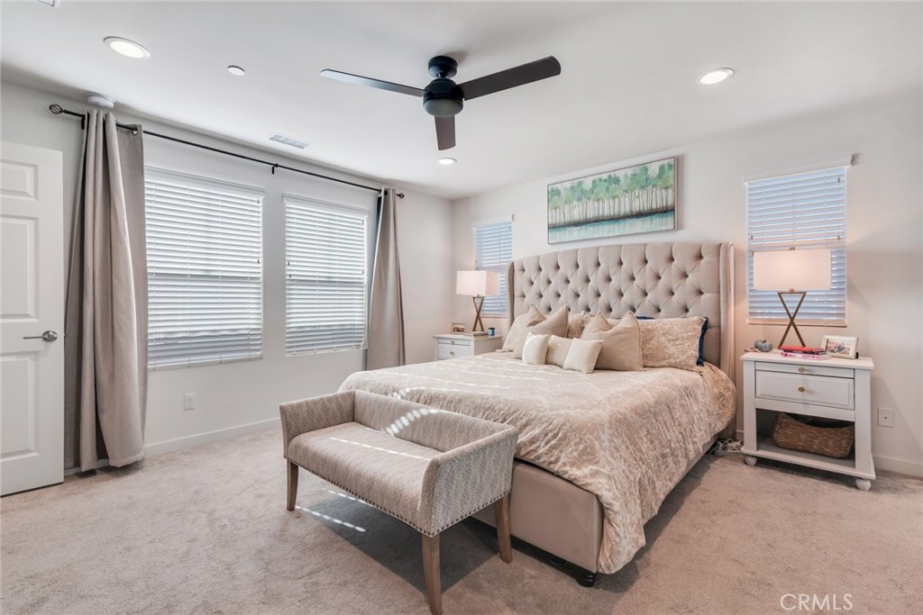 4247 Bravado Court Riverside, CA 92505 - Photo 24 of 33 a bedroom with a bed and a large window