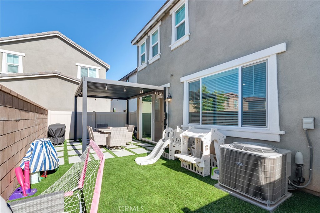 4247 Bravado Court Riverside, CA 92505 - Photo 29 of 33 a view of an house with backyard porch and sitting area