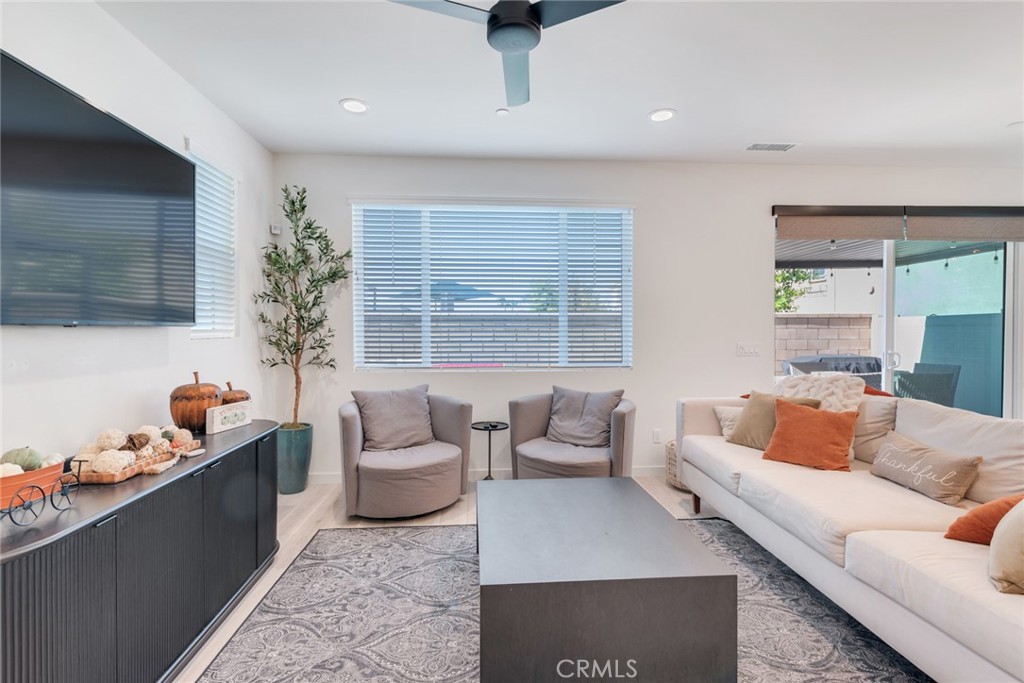 4247 Bravado Court Riverside, CA 92505 - Photo 9 of 33 a living room with furniture and a flat screen tv
