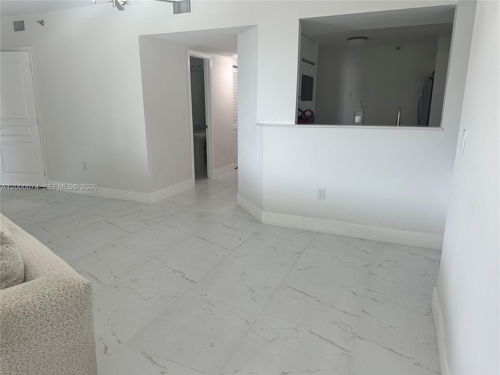 8925 Collins Avenue, Unit 2J Surfside, FL 33154 - Photo 16 of 63 a view of a utility room with mirror