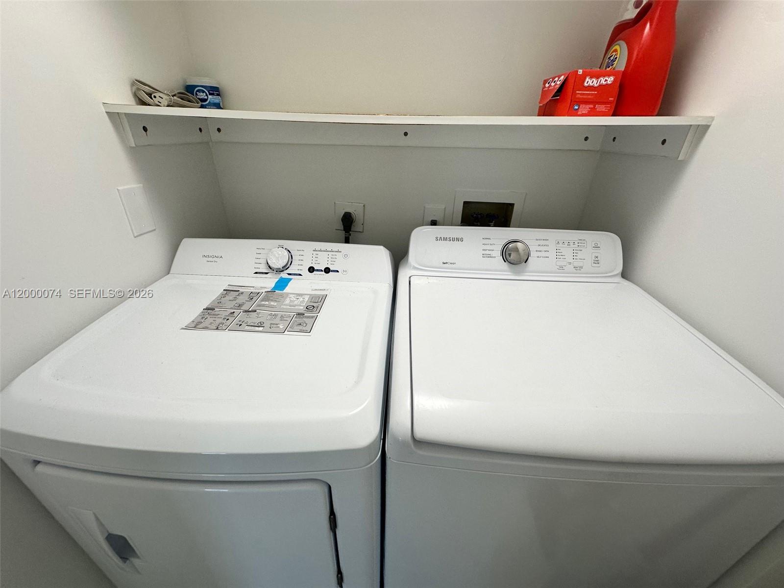 8925 Collins Avenue, Unit 2J Surfside, FL 33154 - Photo 29 of 63 a utility room with dryer and washer