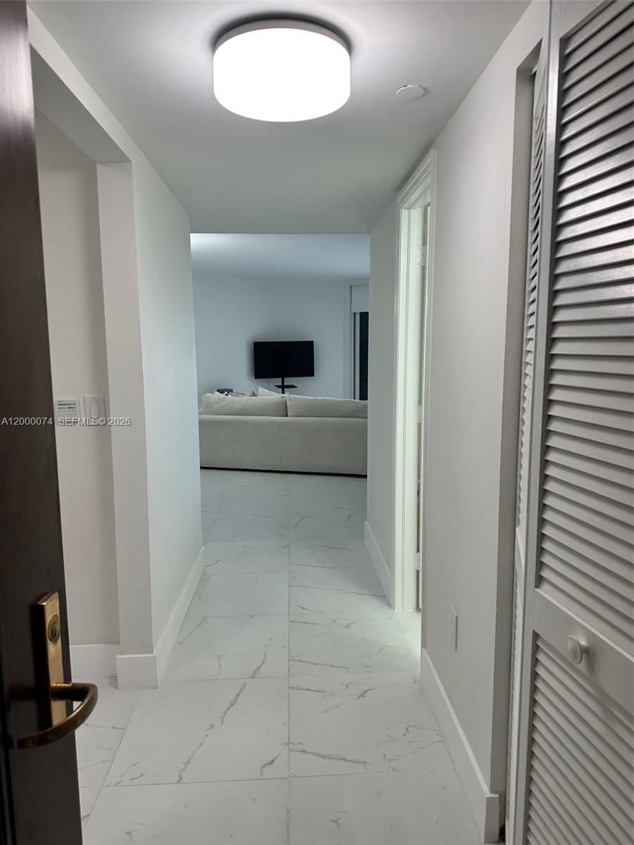 8925 Collins Avenue, Unit 2J Surfside, FL 33154 - Photo 5 of 63 wooden floor in an empty room