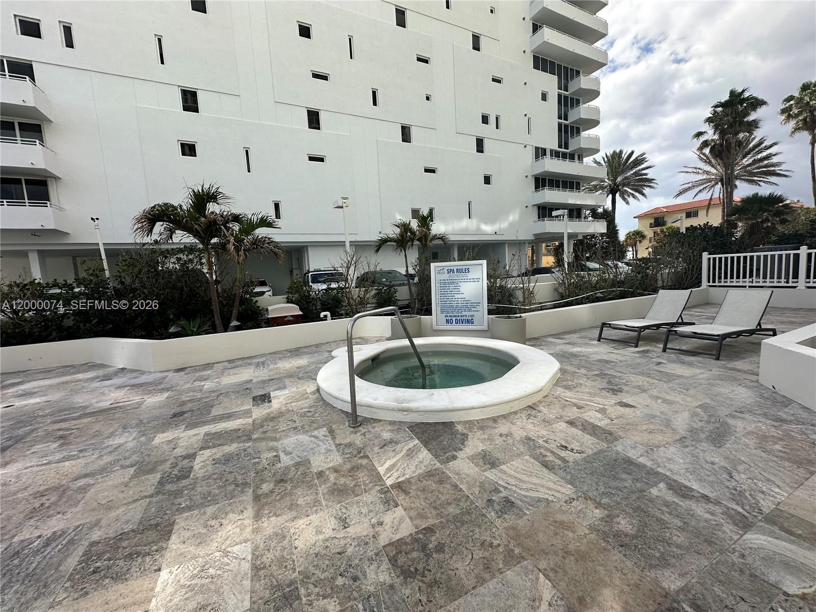8925 Collins Avenue, Unit 2J Surfside, FL 33154 - Photo 56 of 63 a view of a building with backyard