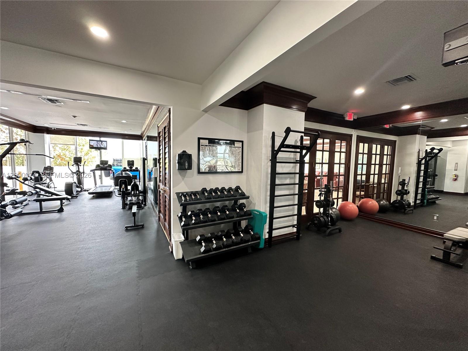 8925 Collins Avenue, Unit 2J Surfside, FL 33154 - Photo 57 of 63 a big room with gym equipment