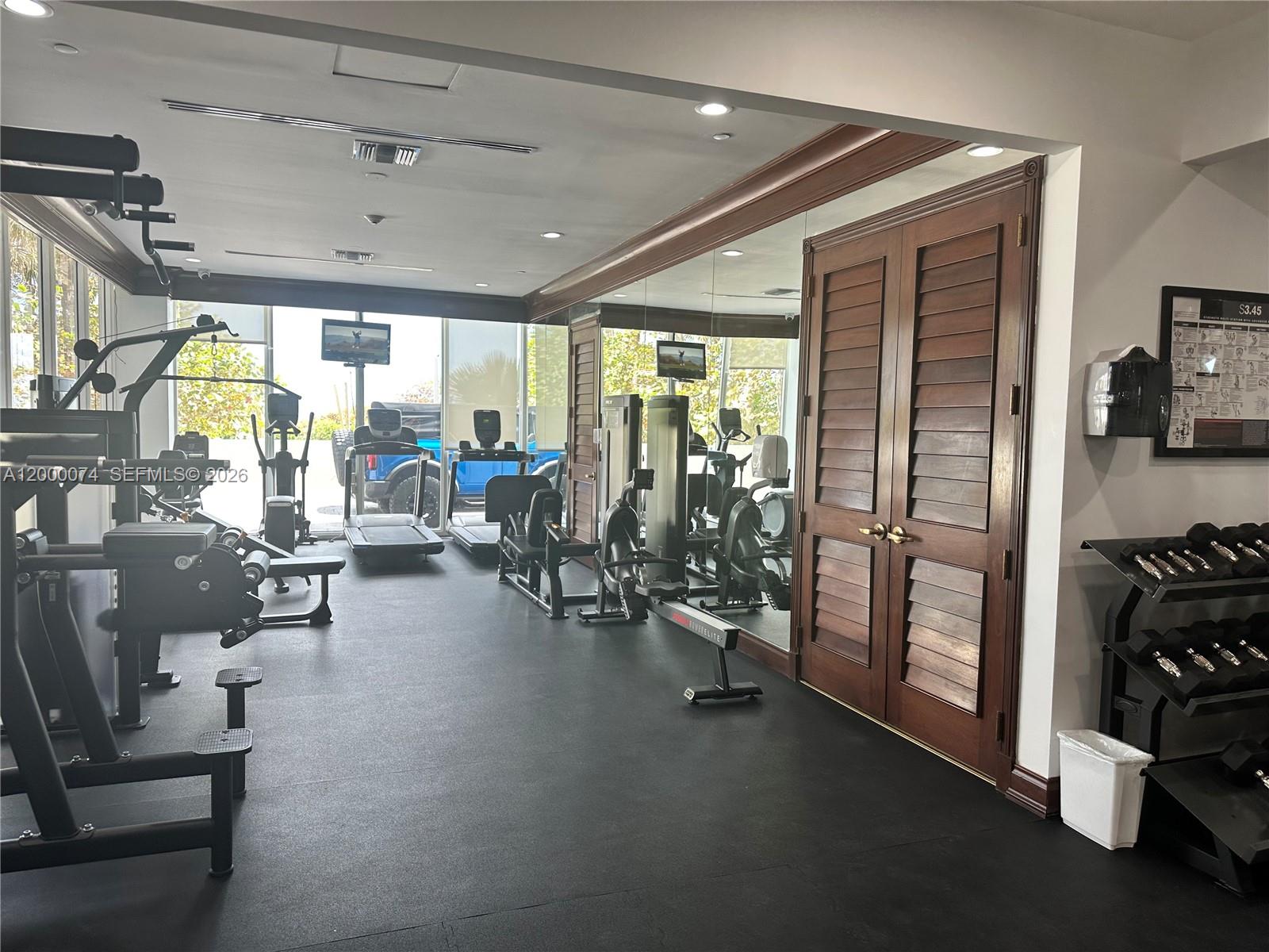 8925 Collins Avenue, Unit 2J Surfside, FL 33154 - Photo 59 of 63 a view of a room with gym equipment