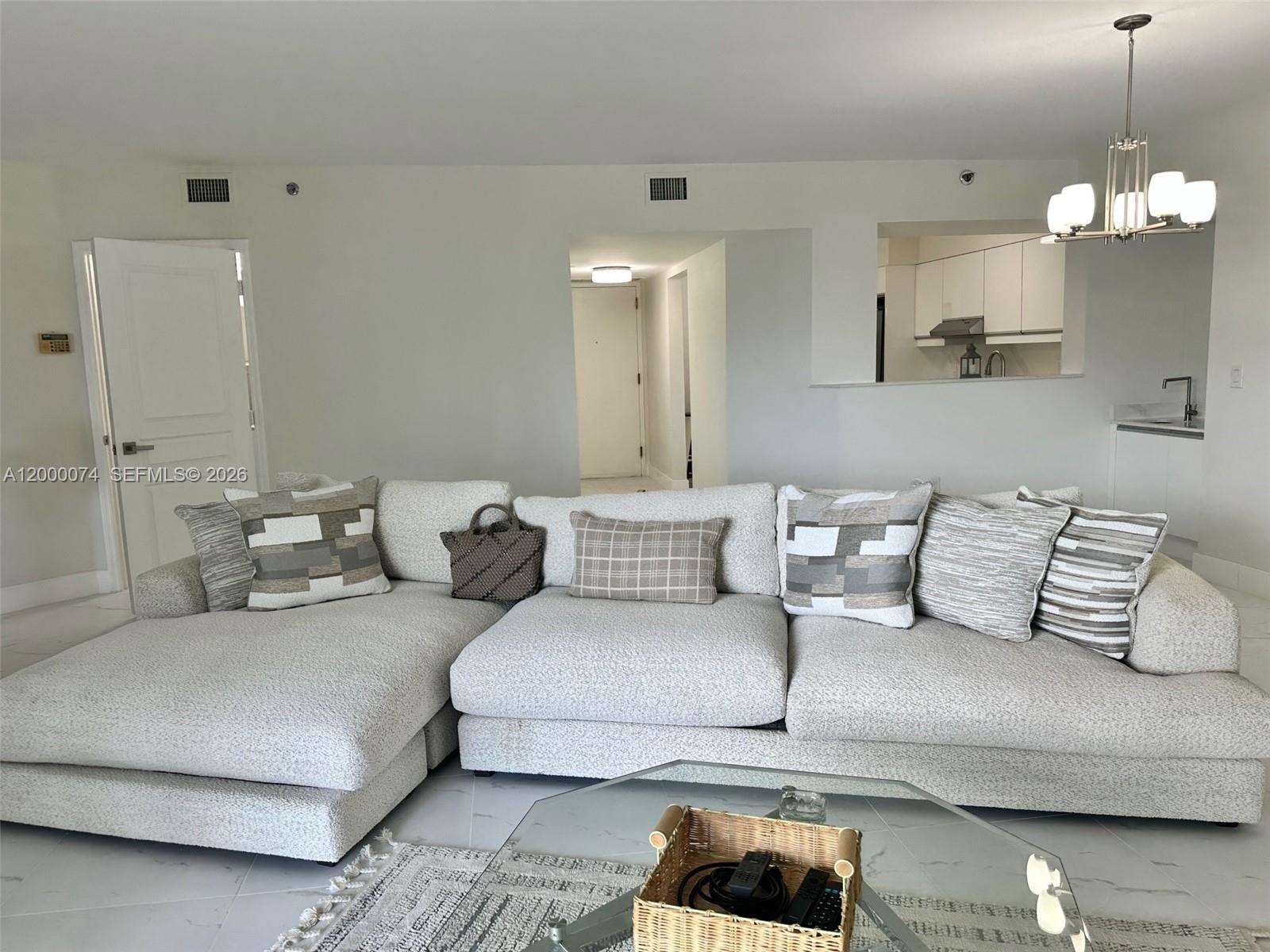 8925 Collins Avenue, Unit 2J Surfside, FL 33154 - Photo 10 of 63 a living room with furniture
