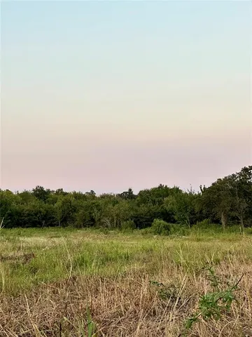 a view of lake with green space