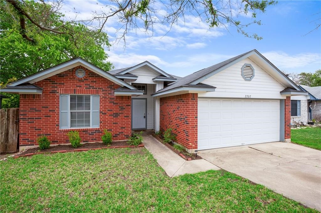 2207 Darnell Drive Cedar Park, TX 78613 - Photo 1 of 1 a front view of a house with a yard and garage
